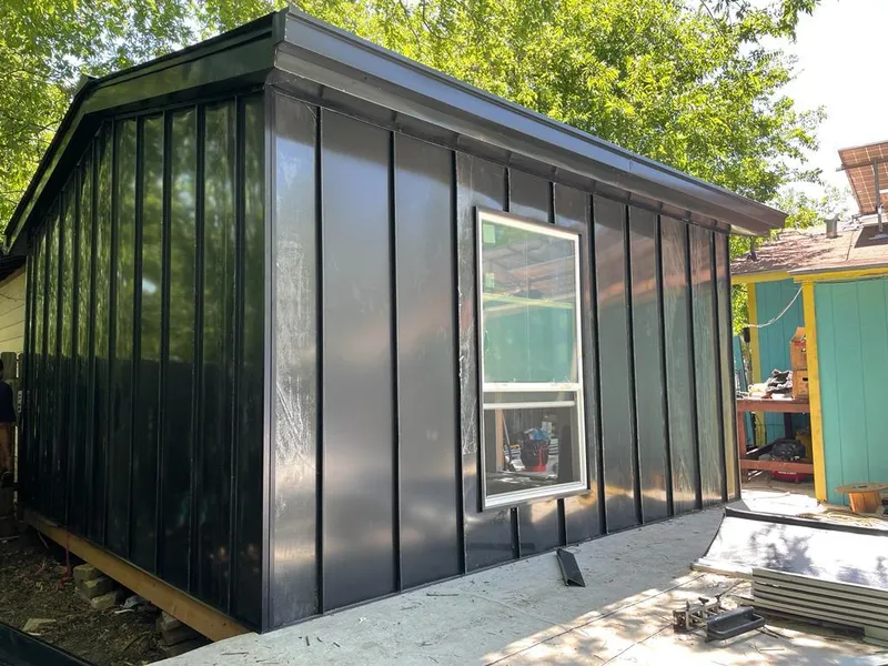 Black standing seam metal wall panels for Roof Inspection in South Weber