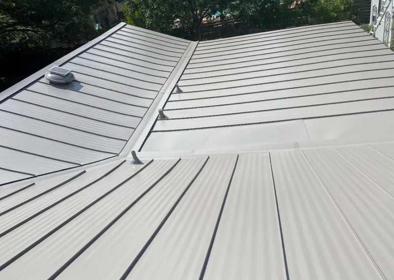 Solar attic fan installed on a metal roof for Roof Ventilation in South Weber